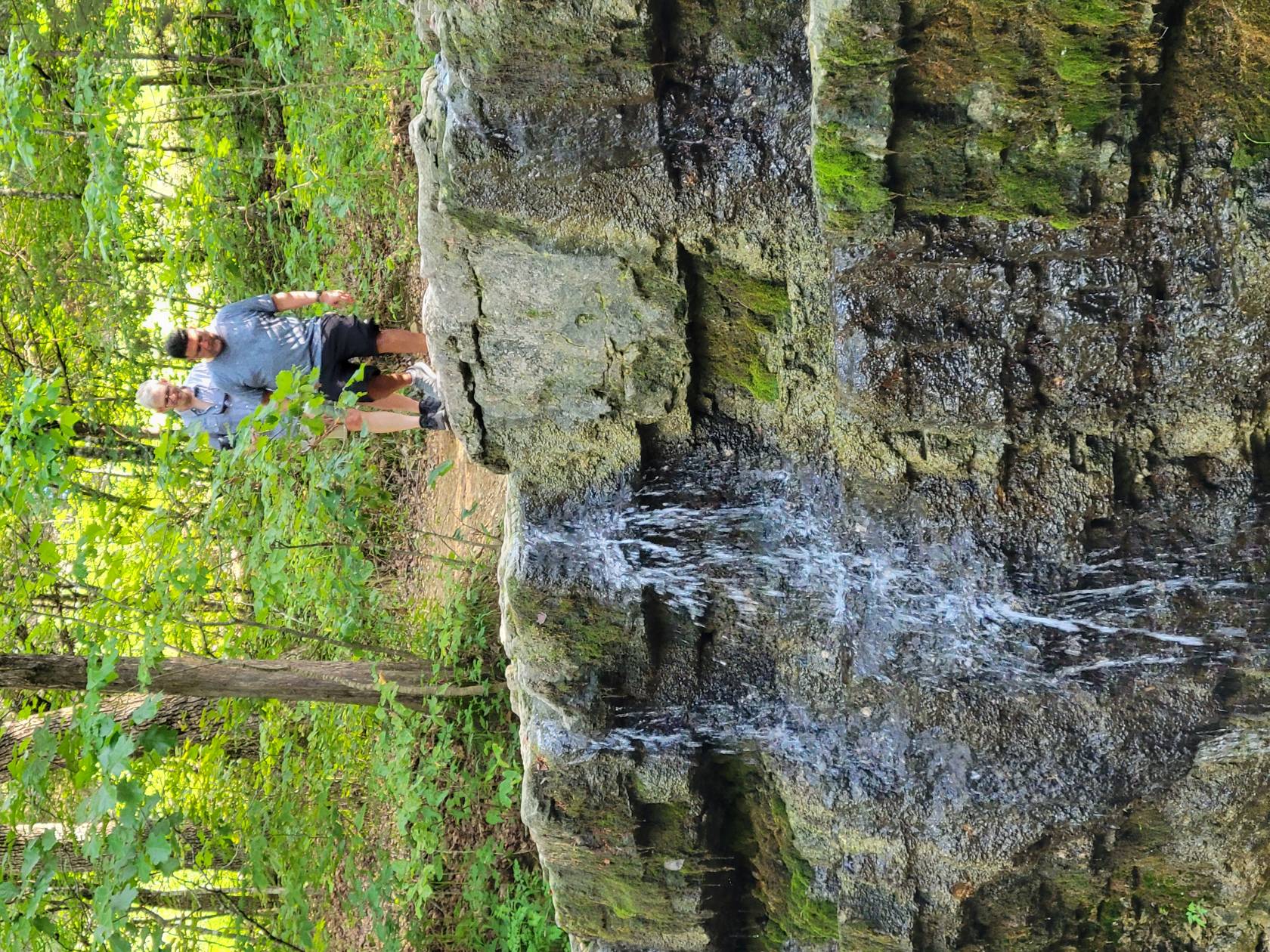 Small waterfall and wooded creek on Waterfall Trail in Branson Missouri