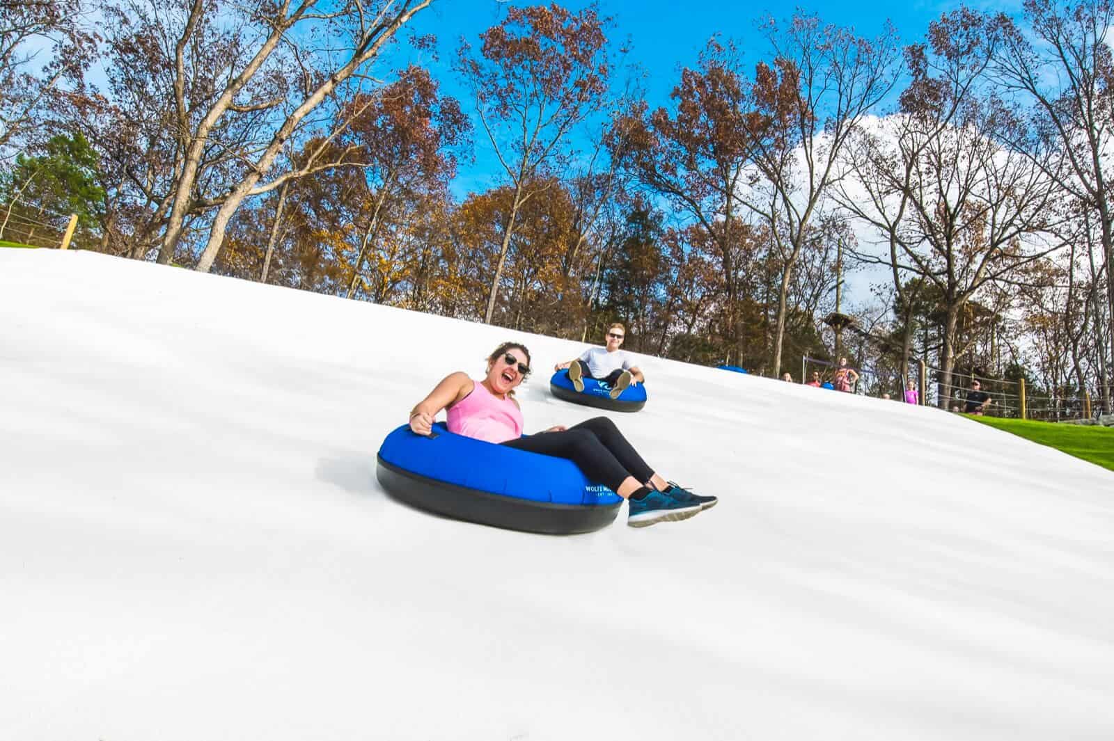 People tubing outdoors in Branson Missouri during winter