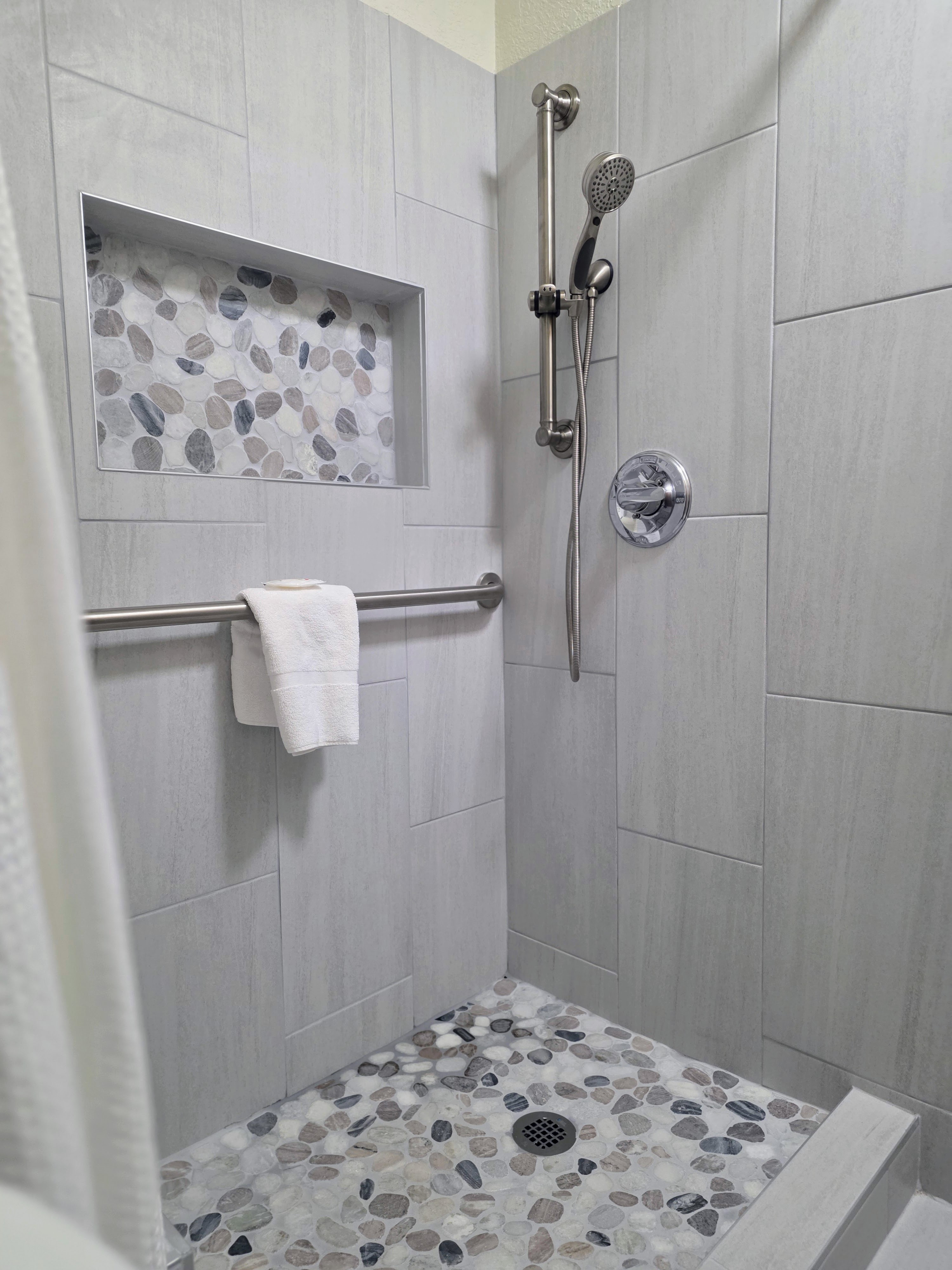 Walk-in shower in a Premium King room
