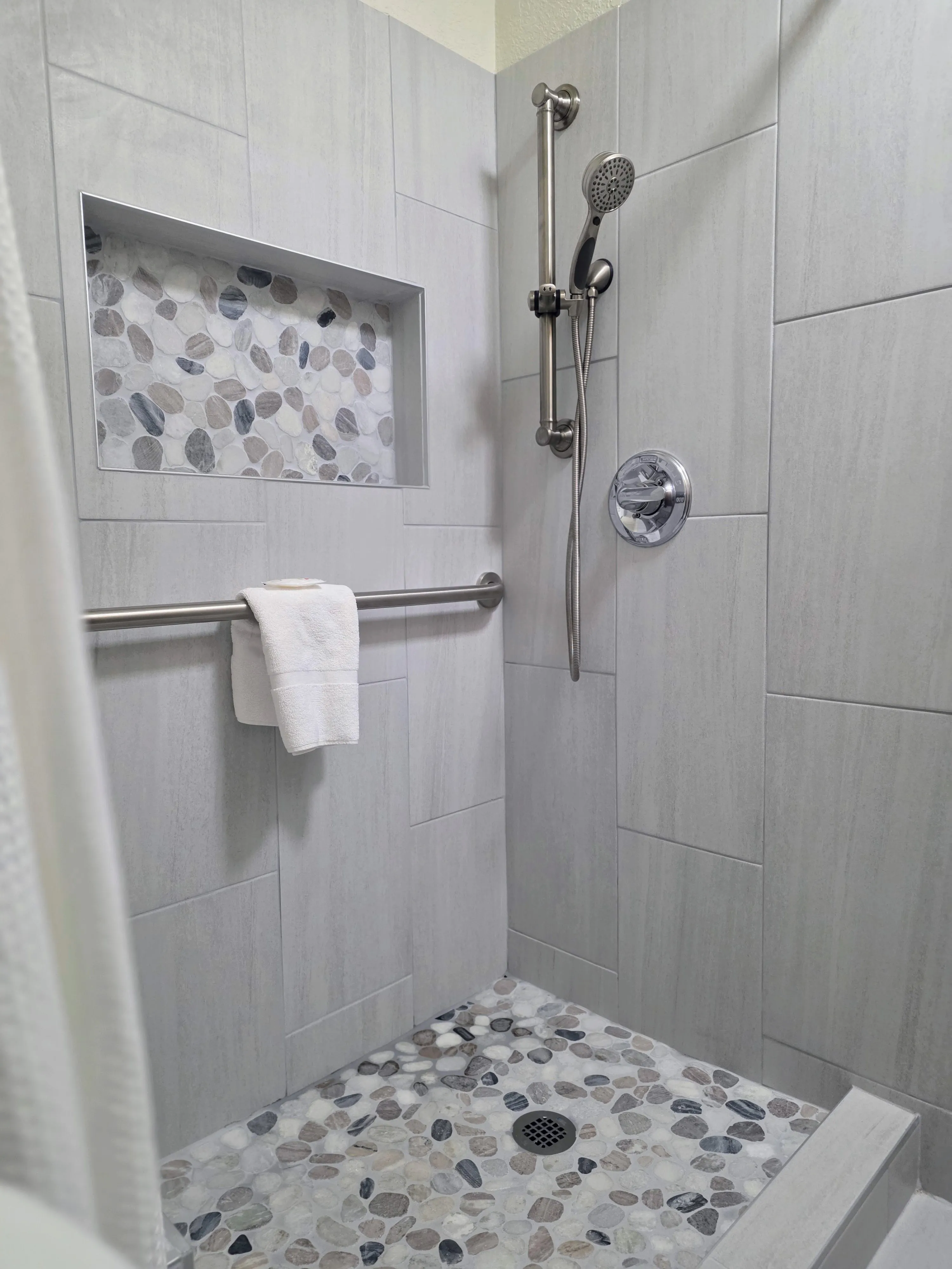 Walk-in shower in a Premium King room